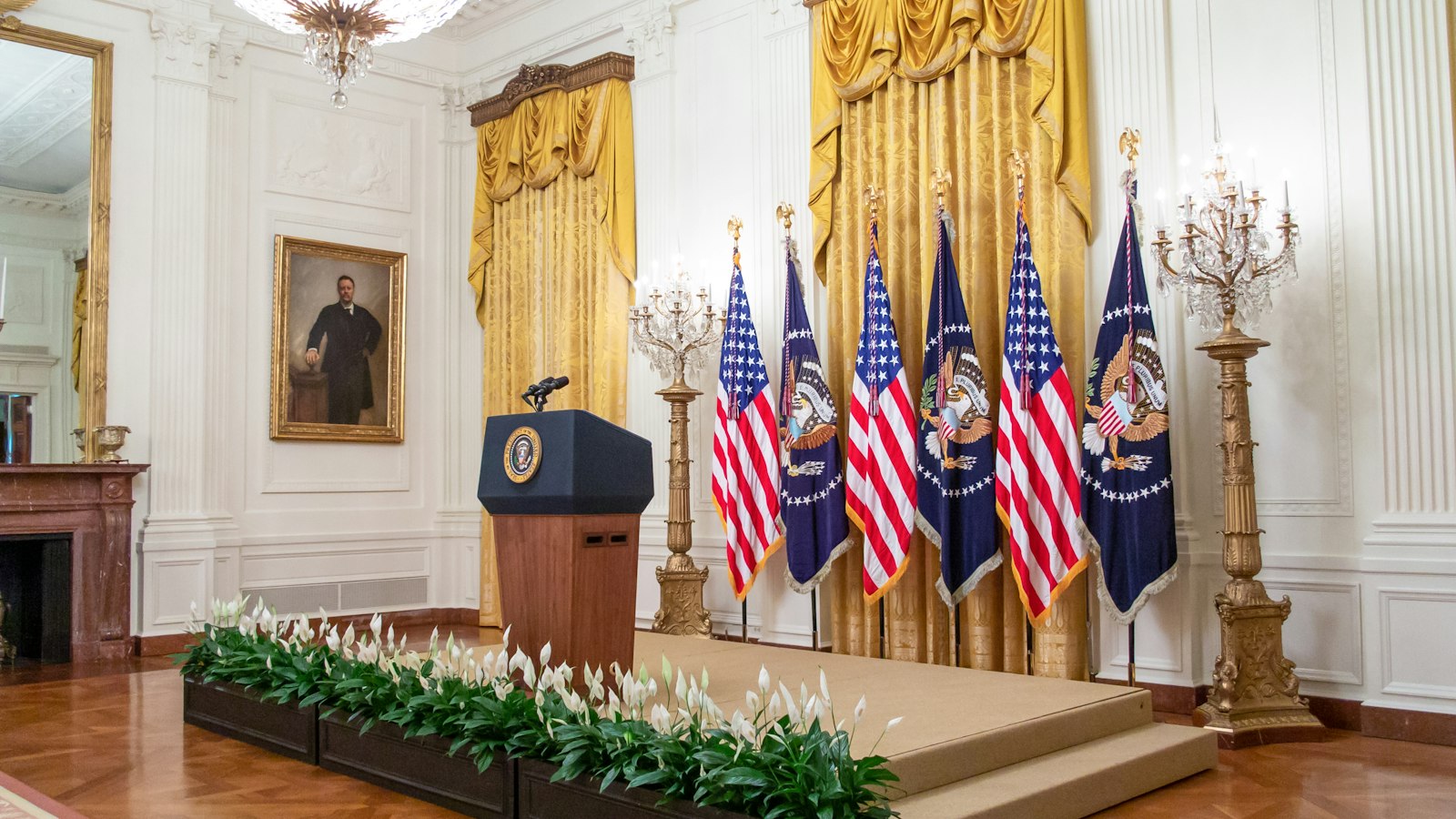European diplomatic meeting with flags and officials in formal setting